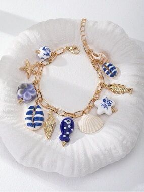 Buy now! Blue and gold sea life charm bracelet